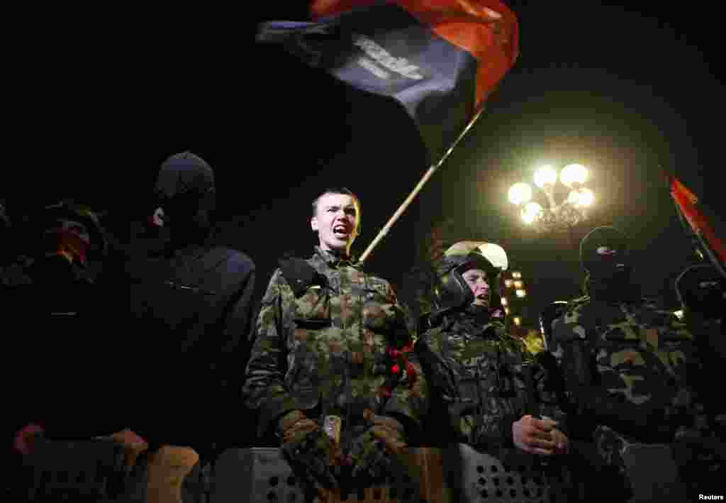 Activists from the Right Sector movement and their supporters gather outside Ukraine&#39;s parliament building to demand the immediate resignation of the interior minister in Kyiv on March 27. (Reuters/Vasily Fedosenko)