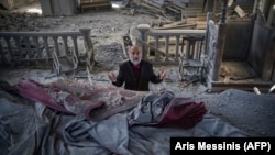 NAGORNO-KARABAKH -- Arthur Sahakyan, 63, prays inside the damaged Ghazanchetsots (Holy Saviour) Cathedral in Shusha , October 13, 2020