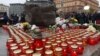 People take part in the ceremony honoring the memory of thousands executed by the Soviet authorities during Josef Stalin's Great Terror at the Solovki Stone memorial in Moscow on October 29, 2018.