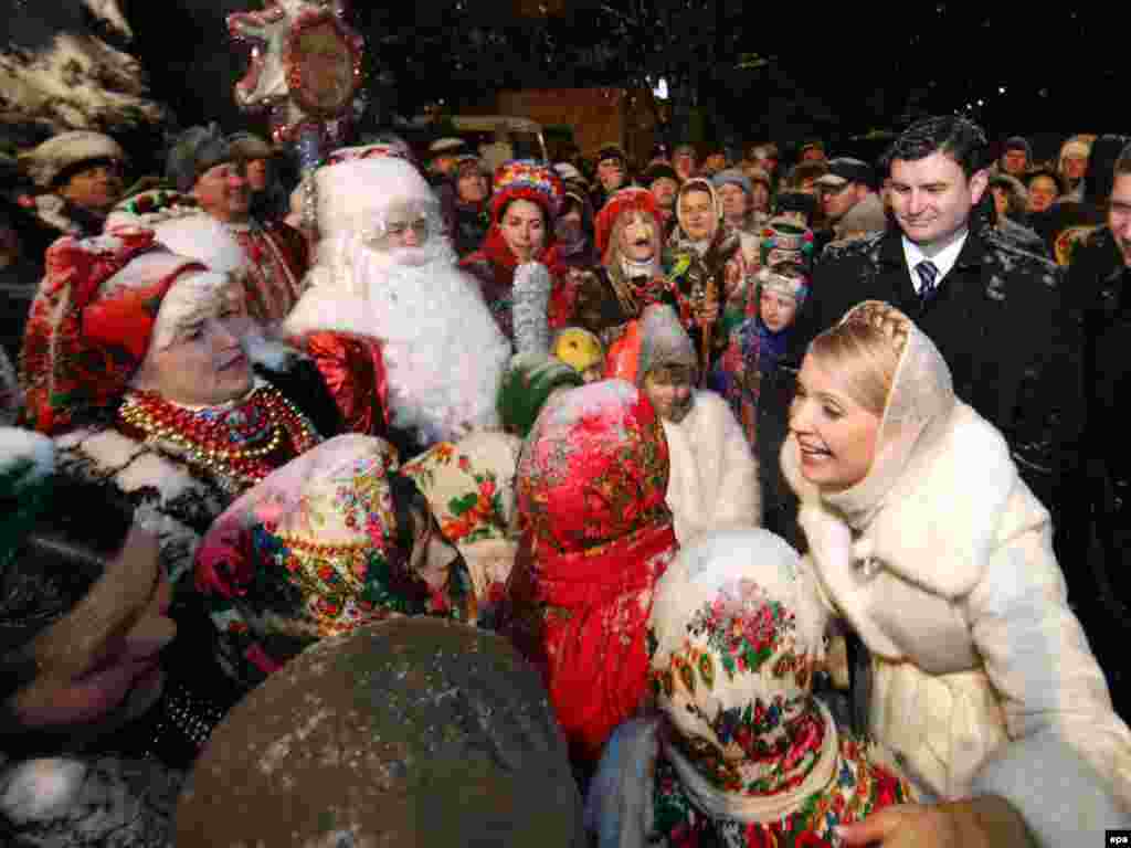 Ukrainian Prime Minister Yulia Tymoshenko greets people during Christmas celebrations in the city of Brovary. - Tymoshenko is now campaigning for the presidential election to be held on January 17. Photo by epa