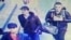 A still image from CCTV camera shows the three men believed to be the attackers walking inside the terminal building at Istanbul airport on June 28.