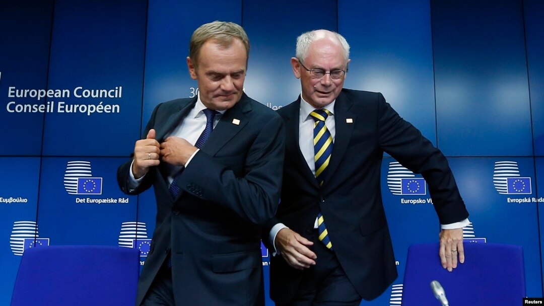 Newly elected European Council President Donald Tusk (left) holds a news conference with outgoing predecessor Herman Van Rompuy during a EU summit in Brussels on August 30.
