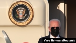 U.S. President Joe Biden gets off Air Force One after arriving ahead of a NATO summit at Brussels Military Airport on June 13. 