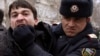 A policeman detains an opposition activist in Baku. (file photo)