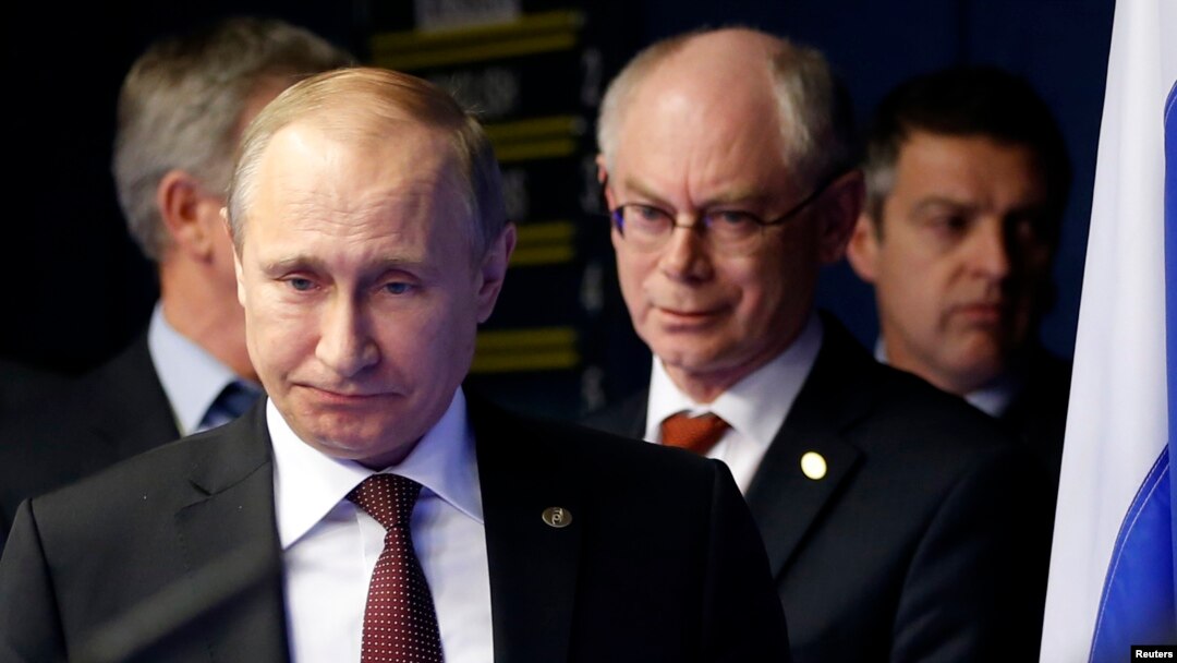 Russian President Vladimir Putin (left) is followed by European Council President Herman Van Rompuy as they arrive for a joint news conference after an EU-Russia Summit in Brussels in January.