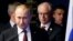 Russian President Vladimir Putin (left) is followed by European Council President Herman Van Rompuy as they arrive for a joint news conference after an EU-Russia Summit in Brussels in January.