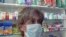 Armenia -- Employee of a drugstore in Yerevan wears a mask, Yerevan, 10Nov2009