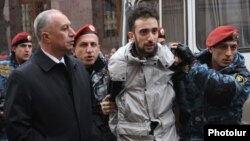 Armenia - Riot police detain a protester in Yerevan, 2Dec2013.