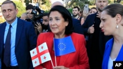 Georgian President Salome Zurabishvili (center) attends a public rally in support of Georgia's EU aspirations in Tbilisi on June 16. 