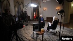 Iranian President Hassan Rohani sits for an interview in Tehran with Ann Curry of the U.S. television channel NBC on September 18.