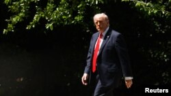 US President Donald Trump departs the White House in Washington.
