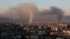 Smoke billows over Beirut's southern suburbs on September 28.