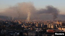 Smoke billows over Beirut's southern suburbs on September 28.