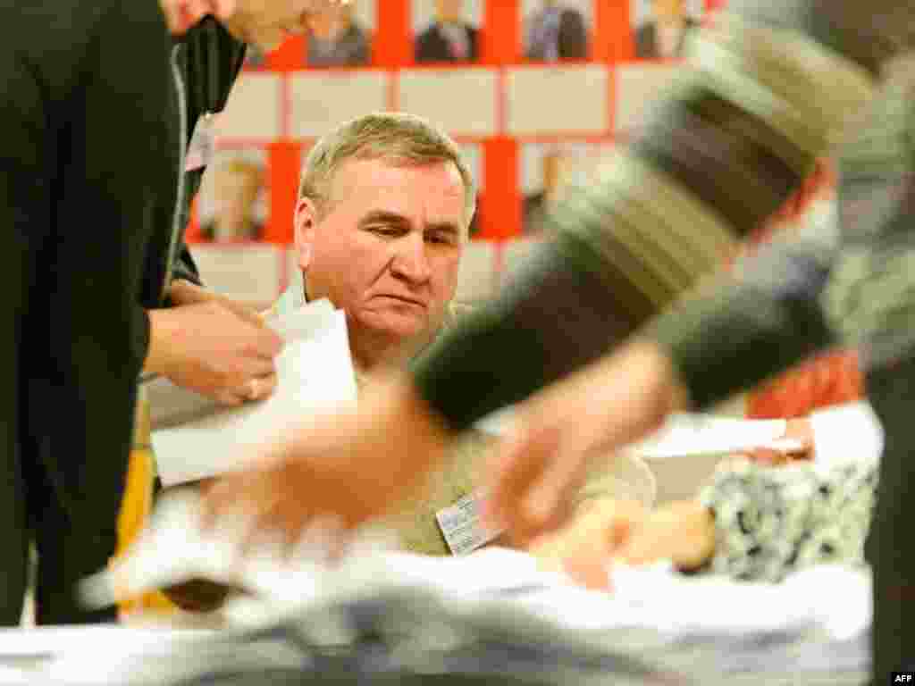 Members of the Election Commission count ballots late on December 19 in Minsk. The incumbent, Alyaksandr Lukashenka, won in the first round with almost 80 percent of the vote.