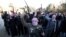 Masked Sunni gunmen shout slogans against the Iraqi Shi'a-led government during a protest in Fallujah on January 7.