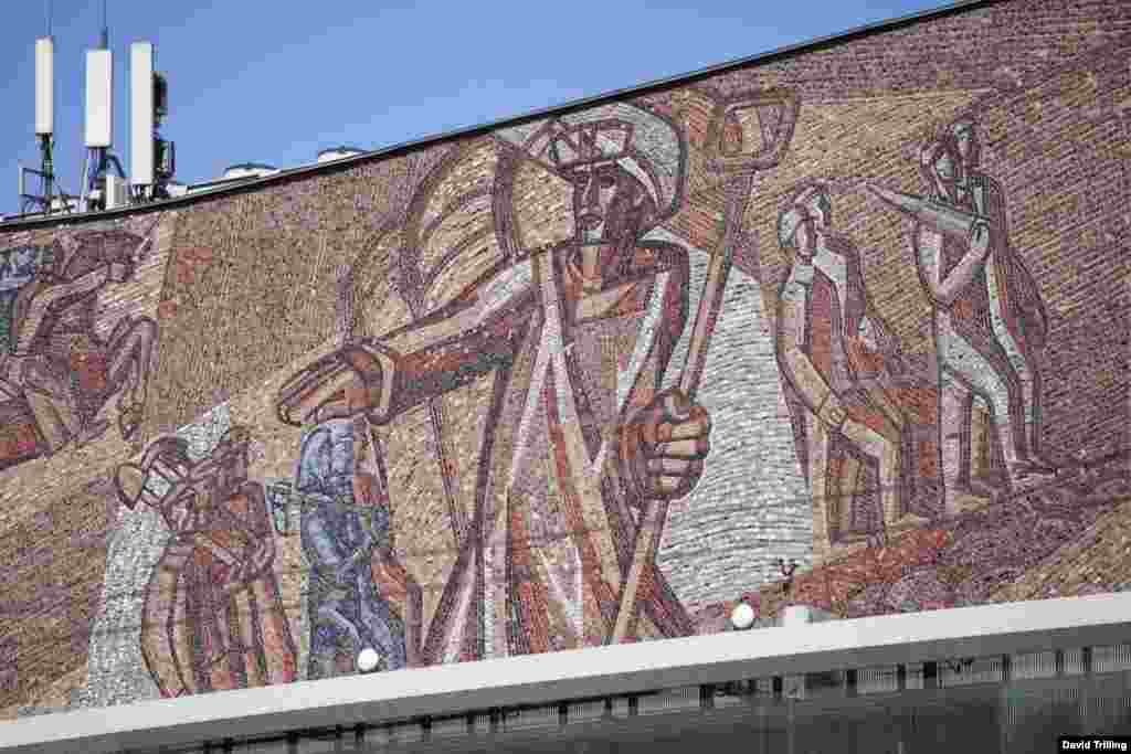 A detail from a mosaic celebrating the Soviet Union&#39;s workers, on Moscow&#39;s Oktyabr Theater.