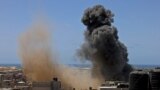 PALESTINE -- Smoke billows from a building targeted during an Israeli airstrike in Rafah in the southern Gaza Strip on May 20, 2021. - Israel and the Palestinians are mired in their worst conflict in years as Israel pounds the Gaza Strip with air strikes 