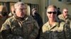 Chairman of the U.S. Joint Chiefs of Staff General Mark Milley (left) talks with General Scott Miller, the commander of U.S. and coalition forces in Afghanistan, at Miller’s military headquarters in Kabul on December 16.