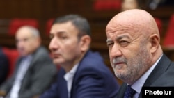 Armenia - Parliament deputy Hovik Aghazarian (right) attends a session of the National Assembly, Yerevan, December 13, 2024.