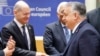 Germany's Chancellor Olaf Scholz (left) shakes hands with Hungary's Prime Minister Viktor Orban in Brussels on February 1.