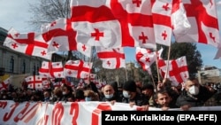 Protesters march in support of Georgian opposition leader Nika Melia in Tbilisi on February 26.