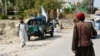 Members of the Taliban inspect the site of a blast in Jalalabad on September 18.