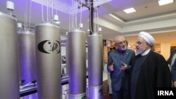 Ali Akbar Salehi, Iran's nuclear chief with President Hassan Rouhani inspecting a nuclear fcility. Apr 9, 2019