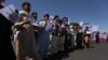 Afghan civilians displaced by fighting in Ghor province protest in the neighboring Herat province on July 26.