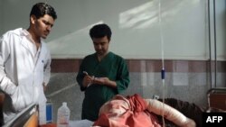 Medical staff tend to an injured civilian at a hospital in Herat on September 29.