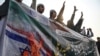 Youth activists of the Muslim Talba Mahaz group shout slogans during a protest against an Iranian air strike, in Islamabad on January 18.