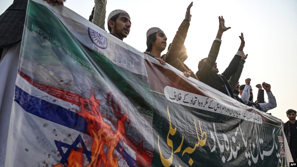 Youth activists of the Muslim Talba Mahaz group shout slogans during a protest against an Iranian air strike, in Islamabad on January 18.