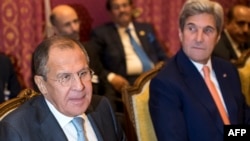 Russian Foreign Minister Sergei Lavrov (left) and U.S. Secretary of State John Kerry during a meeting in Lausanne on October 15