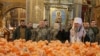 Orthodox priests bless Easter cakes at St. Michael's Cathedral in Kyiv. 