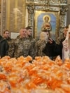 Orthodox priests bless Easter cakes at St. Michael's Cathedral in Kyiv. 