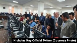 NATO Civilian Representative for Afghanistan Nicholas Kay (2nd R) and British diplomats visited Afghanistan Independent Election Commission National Tally and Data Center to learn about the vote counting prices on October 6.