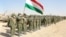 Members of Tajikistan's armed forces line up during joint military drills involving Russia, Uzbekistan, and Tajikistan at the Harb-Maidon training ground near the border with Afghanistan on August 10.
