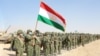Members of Tajikistan's armed forces line up during joint military drills involving Russia, Uzbekistan, and Tajikistan at the Harb-Maidon training ground near the border with Afghanistan on August 10.

