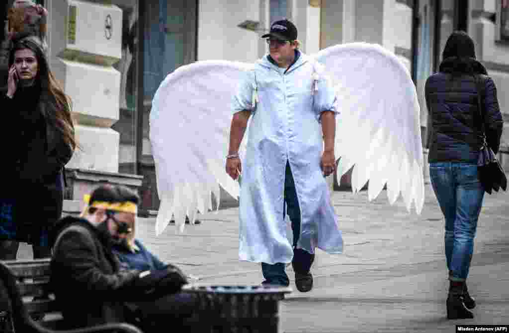 A man with angel wings walks through downtown Moscow in celebration of the Russian Orthodox Easter holiday. (AFP/Mladen Antonov)