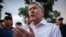 Ex-President Almazbek Atambaev speaks to the media outside his compound in Koi Tash on June 27, 2019.