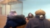 Belarusian artist Henik Loyka (center) at his court hearing in Minsk. 