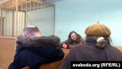 Belarusian artist Henik Loyka (center) at his court hearing in Minsk. 