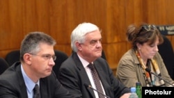 Nigel Mermagen, center, and other members of a Council of Europe observer mission hold a meeting in Armenia.