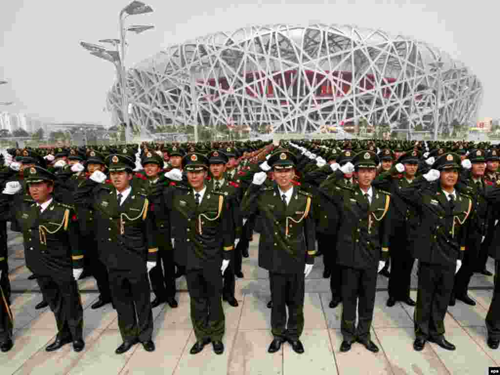 Security at the 2008 Beijing Olympic Games - Paramilitary policemen take part in a rally to ensure the safety of the 2008 Beijing Olympic Games outside theNational Stadium, also known as the 'Bird's Nest', in Beijing, China, 23 July 2008. The Olympics starts on 08 August 2008. 