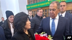 Russian Foreign Minister Sergei Lavrov (right) welcomes North Korean Foreign Minister Choe Son Hui after her arrival in Moscow on November 1.