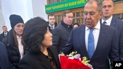 Russian Foreign Minister Sergei Lavrov (right) welcomes North Korean Foreign Minister Choe Son Hui after her arrival in Moscow on November 1.