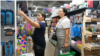 Moldova: Parents and children at a stationery store buying school supplies