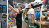 Moldova: Parents and children at a stationery store buying school supplies