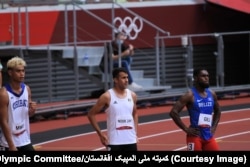 Afghanistan's fastest runner, Shah Mahmud Noorzai (center), hopes to be a record-setter in Paris.