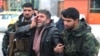 An Afghan man reacts near the site of the suicide attack in Kabul on February 11.