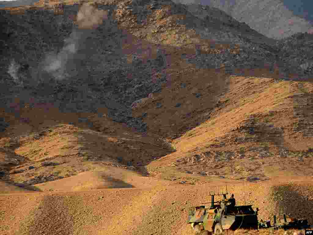 French soldiers in armored vehicles move into position during an operation in Afghanistan. - The French soldiers took part in an operation in Uzbin Valley of Surobi district in Kabul Province on December 17. More than 1,100 soldiers, including 800 French legionnaires as well as U.S. and Afghan commandos, have launched a major operation east of the Afghan capital, military officials said. Photo by Massoud Hossani for AFP